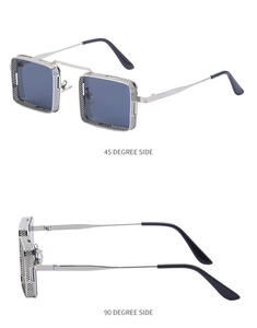 Détail de lunettes steampunk avec monture en maille argentée et verres bleu foncé