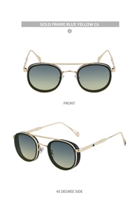 Detail of vintage oval sunglasses with gold frames and blue yellow gradient lenses