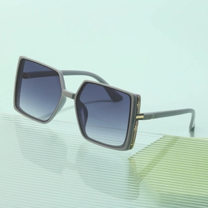 Fashionable oversized square sunglasses with gray frames and purple gradient lenses