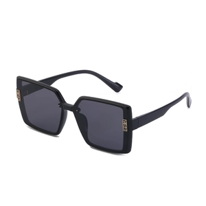 Chic black oversized square polarized sunglasses with decorative gold geometric temples
