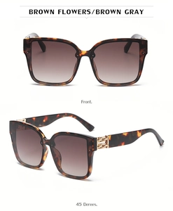 Detail of square oversized tortoiseshell sunglasses with gold chain accents and brown lenses
