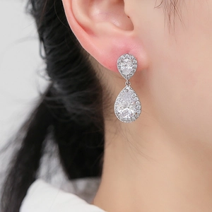Elegant silver teardrop zircon earrings with layered pear-cut stones for bridal occasions