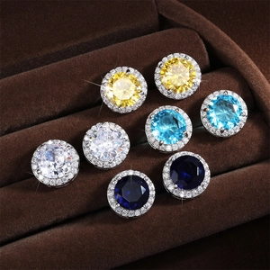 Set of four minimalist silver-tone halo stud earrings with colorful AAA cubic zirconia