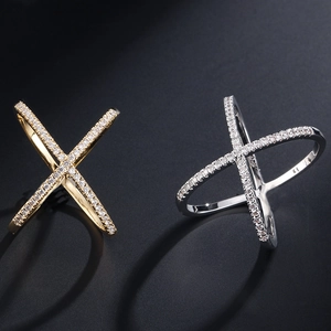 Crossed X-shape zircon rings in gold and silver finish with minimalist micro-pave setting