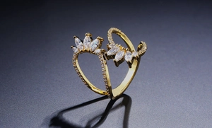 Macro detail of 18K gold ring featuring marquise-cut zircons and pavé-set accents