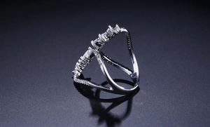 Macro shot of silver adjustable crisscross ring with rectangle-cut zircon stones