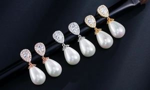Teardrop pearl earrings set with zircon in rose gold, silver and gold finishes