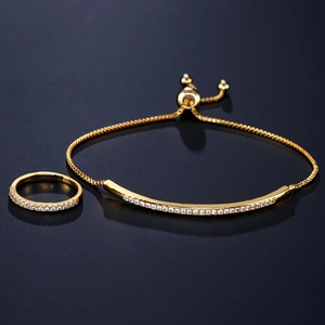 Elegant adjustable gold bracelet and ring set with AAA cubic zirconia in a modern design