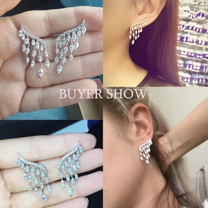 Boucles d'oreilles ailes argentées avec pampilles, zircons marquise et design plumes