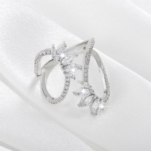 Adjustable silver wrap ring featuring marquise-cut zircons and pavé stone details