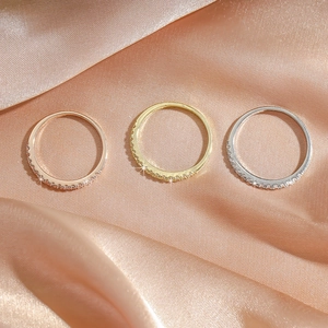 Three-piece set of thin cubic zirconia rings in rose gold, gold, and silver finishes