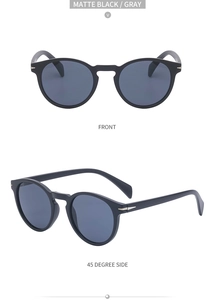 Matte black round sunglasses with gray lenses featuring metal arrow hinge details