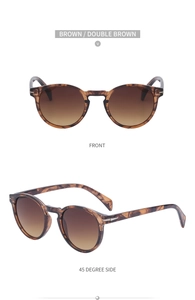 Retro tortoise shell sunglasses with brown gradient lenses and silver metal arrow detail