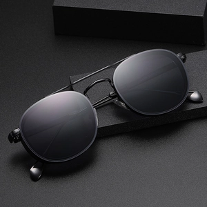 Classic oval frame pilot sunglasses with matte black metal frame and dark gray lenses