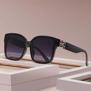 Fashionable oversized square black sunglasses with silver chain temple detail