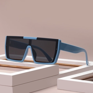 Flat top square sunglasses with blue and black two-tone frame and grey lenses
