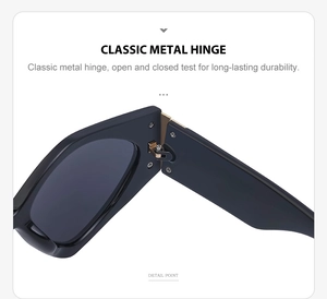 Close-up of durable golden metal hinge and sleek black frame on classic sunglasses