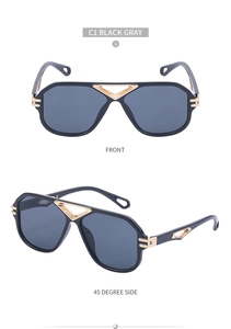 Detail view of steampunk aviator sunglasses with gold hollow metal bridge and black lenses