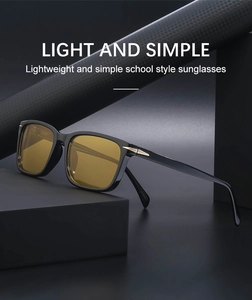 Detail of square sunglasses with yellow lenses and golden arrow temple accents