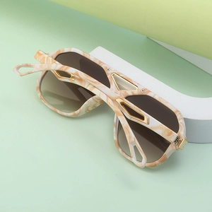 Steampunk pilot sunglasses with marble texture frame and gold metal accents