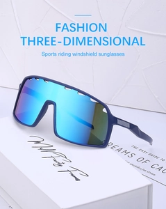 Detail of blue matte cycling sunglasses with ventilated frames on a white brand box