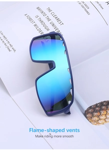 Detail of blue matte cycling sunglasses with flame-shaped vents and gradient lenses
