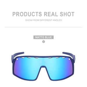 Detail of matte blue cycling sunglasses with aerodynamic ventilation holes and gradient lens