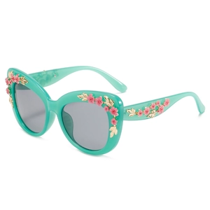 Mint green cat eye sunglasses with decorative pink floral accents and gold metal leaves