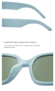 Detail of light blue wide-leg sunglasses featuring lightweight integrated nose pads