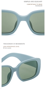 Detail view of mint green square sunglasses featuring thick temples and integrated nose pads