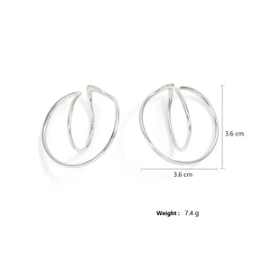 Detail view of silver Mobius hoop earrings with 3.6cm size and 7.4g weight measurements