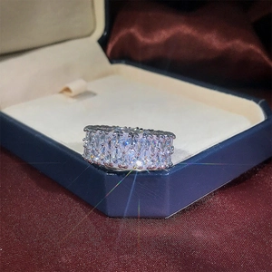 Macro shot of silver wide band ring with double rows of sparkling pave-set cubic zirconia