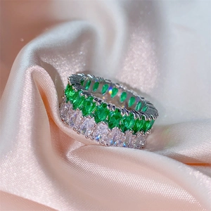 Luxury double-row marquise cut ring with green and clear zircon on pink silk fabric