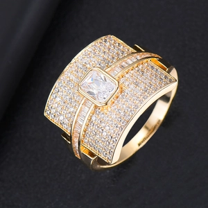Detailed close-up of a wide gold-plated ring featuring multi-layer micro-pave zircon crystals