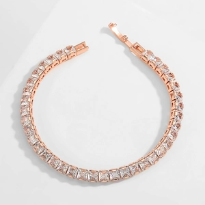 Detailed shot of rose gold tennis bracelet featuring square-cut sparkling cubic zirconia
