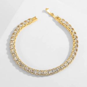 Elegant gold tennis bracelet with cubic zirconia stones in a minimalist single row design