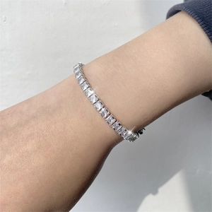 Elegant silver tennis bracelet featuring square-cut sparkling cubic zirconia stones