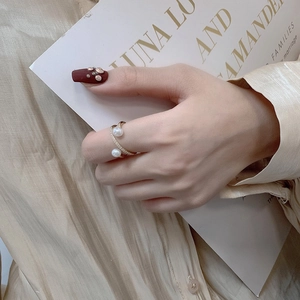 Elegant gold double pearl ring with zircon accents for women in a luxury minimalist style