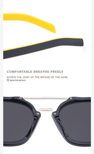 Detail of retro square sunglasses featuring dual-beam silver bridge and matte two-tone arms