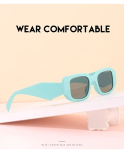Detail of mint green rectangle sunglasses with wide temples on a geometric platform
