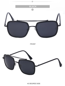 Close-up of polarized square metal sunglasses with embossed textures and double bridge