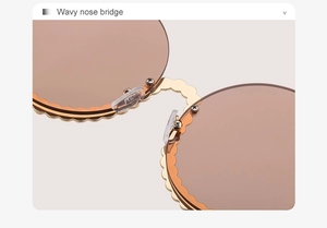 Detail des gewellten goldenen Nasenstegs einer runden Sonnenbrille mit Silikonpads