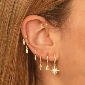 Minimalist gold geometric hoop earrings set with zircon stones for a trendy layered look