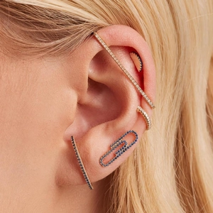 Golden ear cuff set with blue and white zircons featuring a unique paperclip stud design