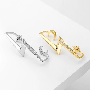 Minimalist lightning bolt ear cuffs with moon and star accents in gold and silver