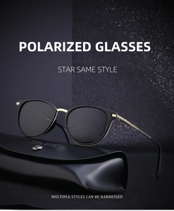 Close-up of black and gold polarized sunglasses on a luxury leather hard case