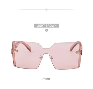 Vue frontale de lunettes de soleil sans monture marron clair avec pont en métal doré