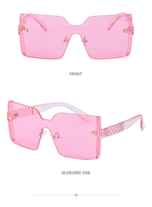 Détail de lunettes de soleil roses sans monture avec branches à motifs diamant gravés