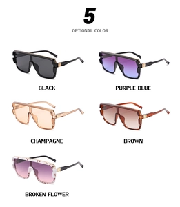 Detailed view of oversized cycling sunglasses in five colors with gold metal accents
