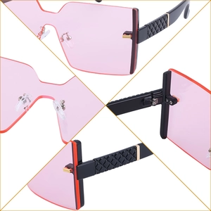 Lunettes de soleil oversize sans monture avec verres roses et branches noires matelassées